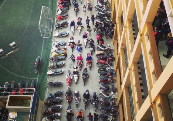bird's-eye view photo of row of motorcycles on road
