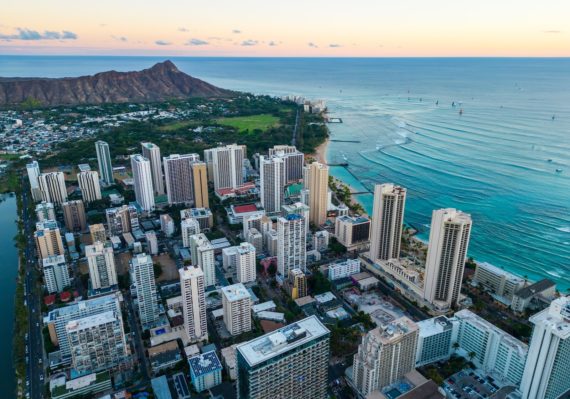 an aerial view of a city by the ocean