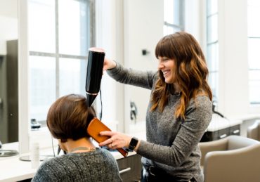 woman holding hair dryer