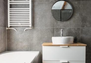 white ceramic bathtub beside white ceramic bathtub