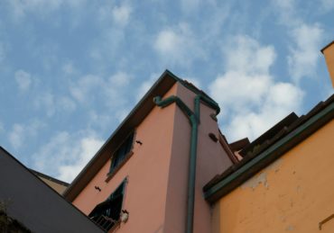 concrete building with gutter