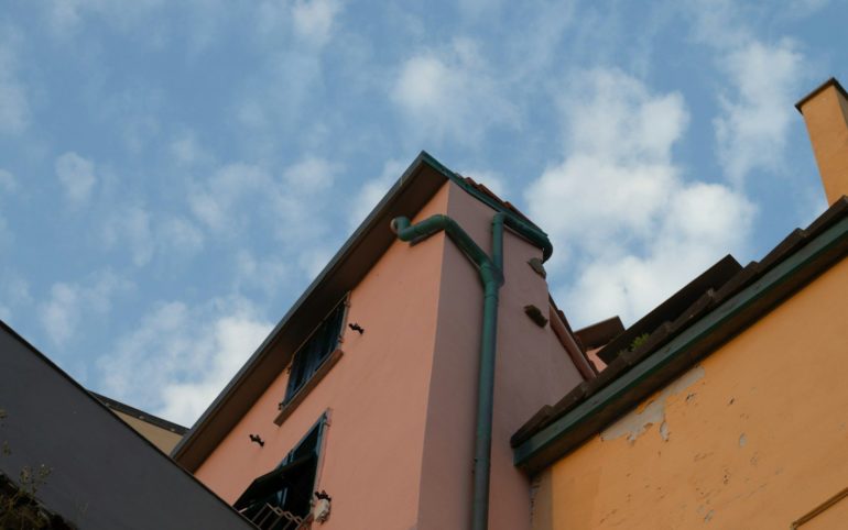 concrete building with gutter